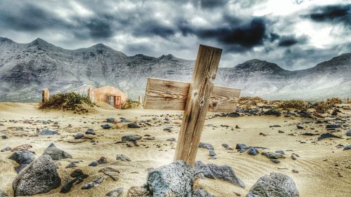 Scenic view of mountains against cloudy sky