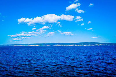 Scenic view of sea against blue sky
