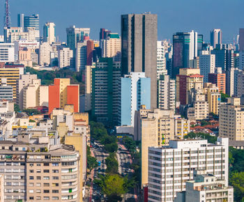 High angle view of buildings in city against sky