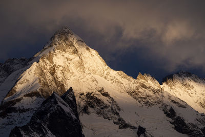 Scenic view of snowcapped mountains against sky during sunset