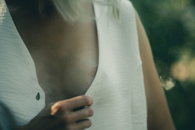 Midsection of woman holding hands