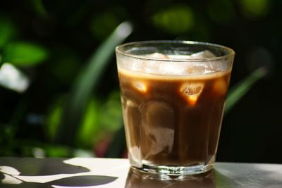 Close-up of coffee in glass on table