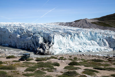 Scenic view of snowcapped mountains against clear sky