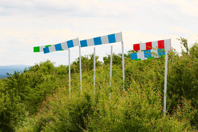 Multi colored flags against clear sky