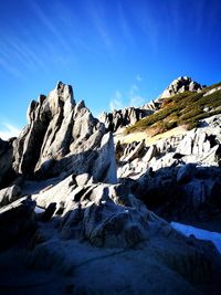 Scenic view of mountains against clear blue sky