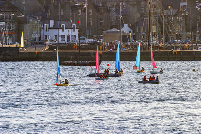 People on sailboat in sea