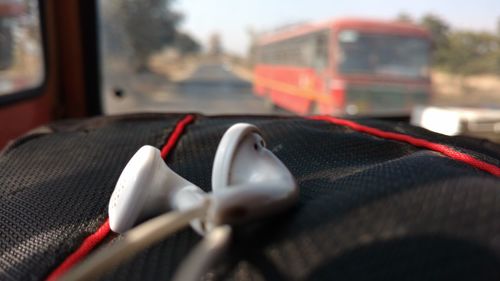 Close-up of red car in bus