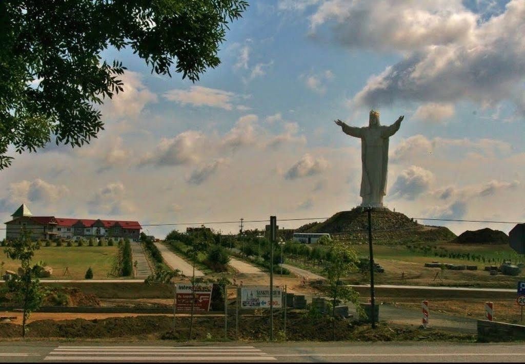 sky, cloud - sky, tree, architecture, statue, plant, sculpture, nature, representation, built structure, religion, human representation, day, art and craft, no people, spirituality, belief, travel destinations, building exterior, outdoors, arms raised