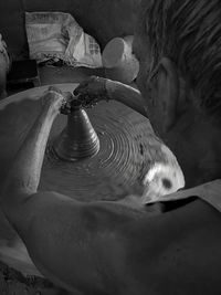 High angel view of potter working at workshop