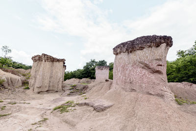 View of rock formation on land against sky