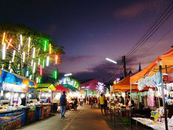 People in market at night