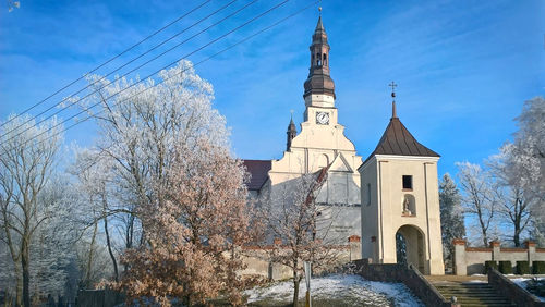 Low angle view of bell tower against sky