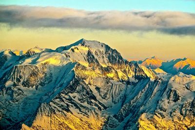 Scenic view of mountains against sky during winter