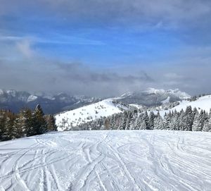 Scenic view of snowcapped mountains against sky