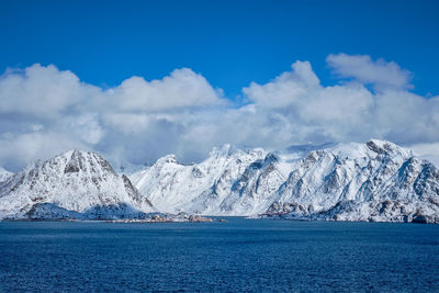 Scenic view of snowcapped mountains against sky