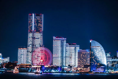 Illuminated buildings in city at night