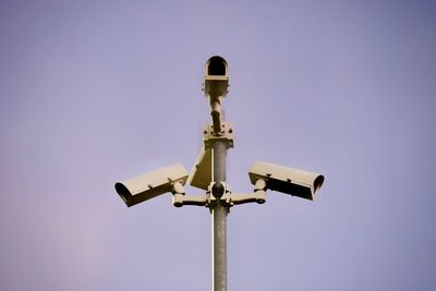 Low angle view of communications tower against clear sky