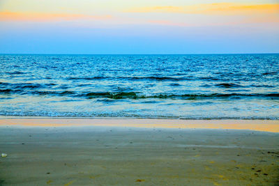 View of calm blue sea at sunset