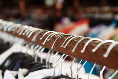 Close-up of coathanger on rack