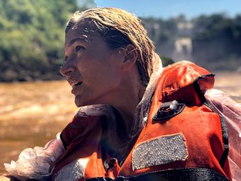 Close-up of woman looking away while rafting