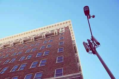 Low angle view of building against clear blue sky