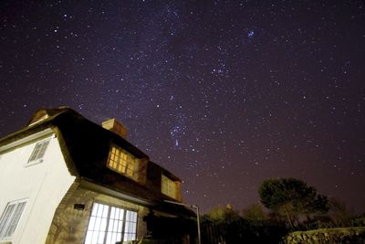 Low angle view of stars in sky at night