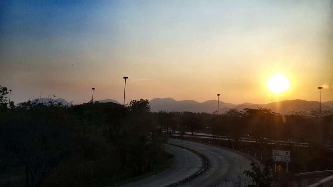 COUNTRY ROAD AT SUNSET