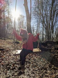 Full length of woman standing on field against sky
