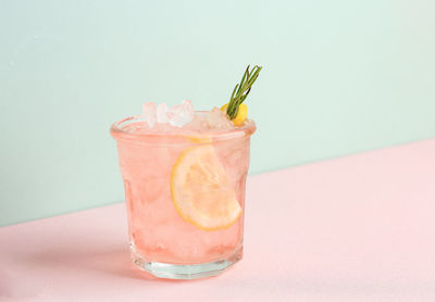 Close-up of drink in glass against white background