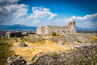 Old ruin building against cloudy sky