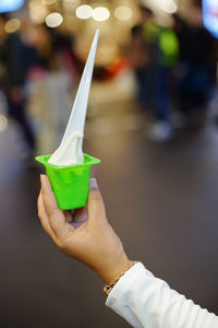 Close-up of hand holding ice cream