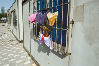 Clothes drying on coathanger over security bars