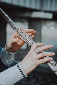 Close-up of hands playing guitar