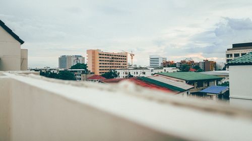 High angle view of buildings in city against sky