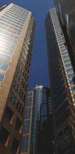 Low angle view of modern buildings against clear sky