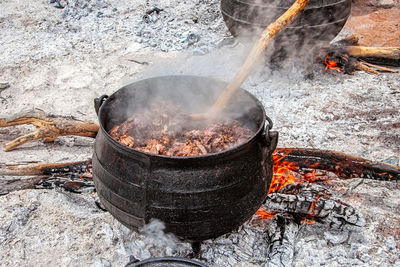 High angle view of fire on barbecue grill