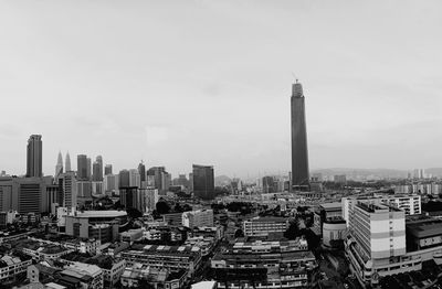 High angle view of buildings in city against sky