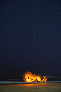 Light painting against sky at night