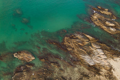 High angle view of rock formation in sea