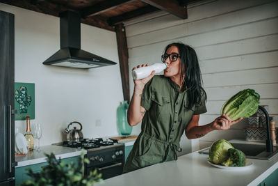 Woman holding food at home