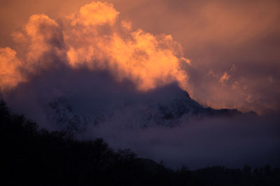 Scenic view of silhouette mountains against sky during sunset