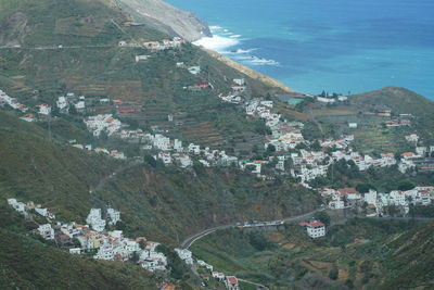 High angle view of townscape by sea