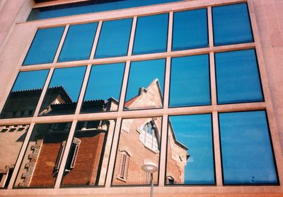 Low angle view of building against blue sky