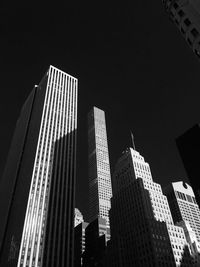 Low angle view of buildings against sky at night