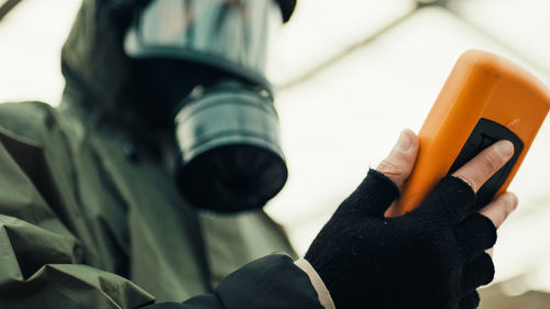 Man with geiger counter in radioactive site