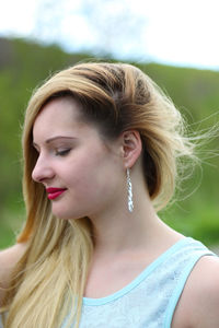 Close-up of beautiful young woman with blond hair