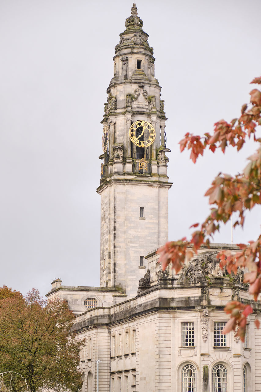 architecture, building exterior, built structure, tower, building, clock, travel destinations, clock tower, tree, nature, history, time, the past, travel, city, sky, plant, tourism, low angle view, no people, landmark, place of worship, religion, day, bell tower, outdoors, old, belief, town