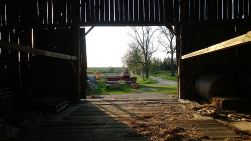 Empty road amidst buildings against sky