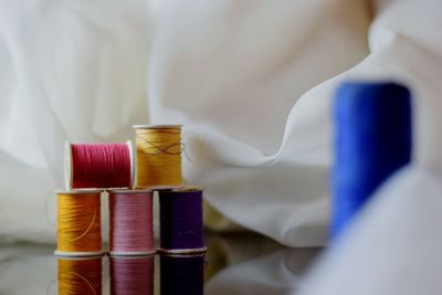 Colorful thread spools by fabrics