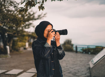 Man photographing with camera